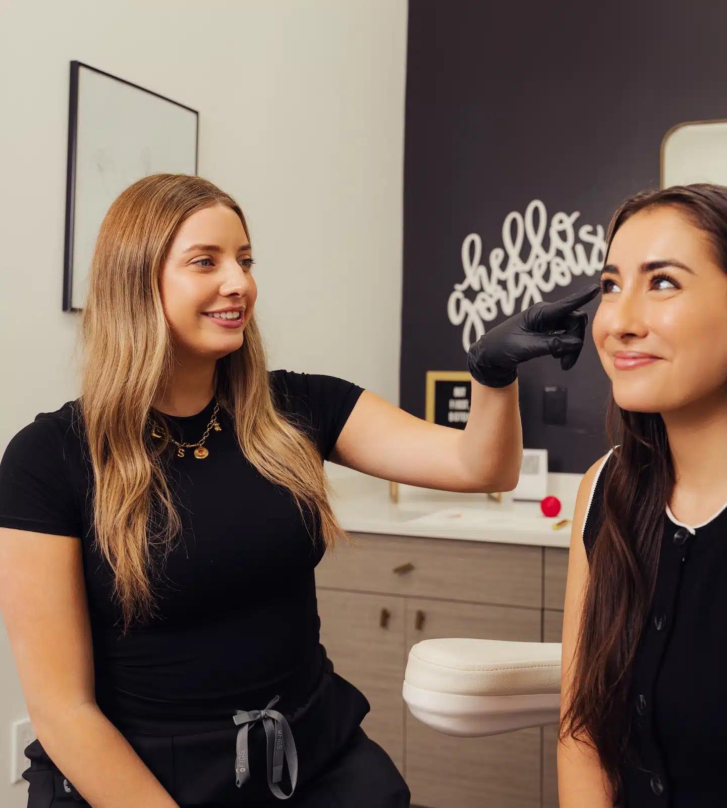 woman receiving sculptra consultation