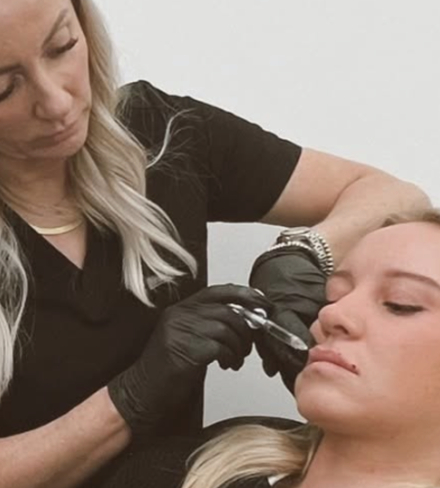 woman receiving filler injection