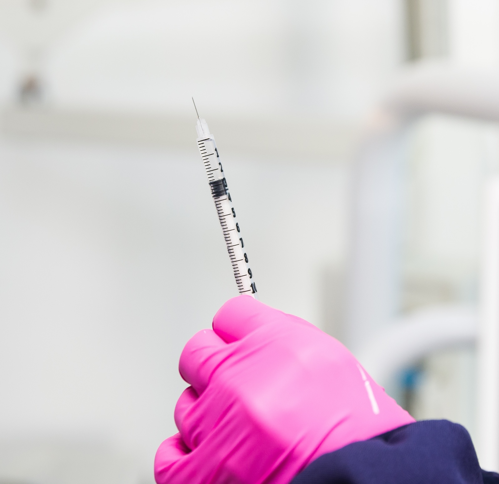 woman holding needle woman holding needle