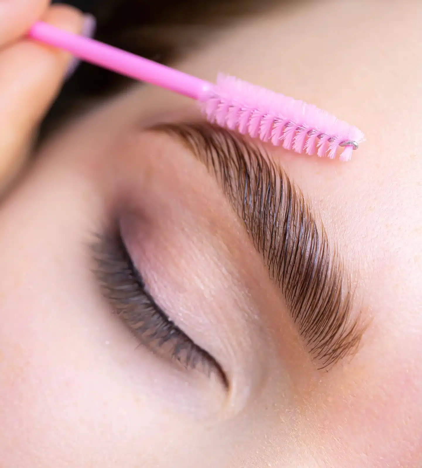 woman receiving brow lamination treatment
